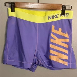 Yellow and purple Nike spandex